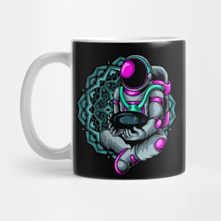 Fun Astronaut holding a Galaxy in front of a Mandala Mug